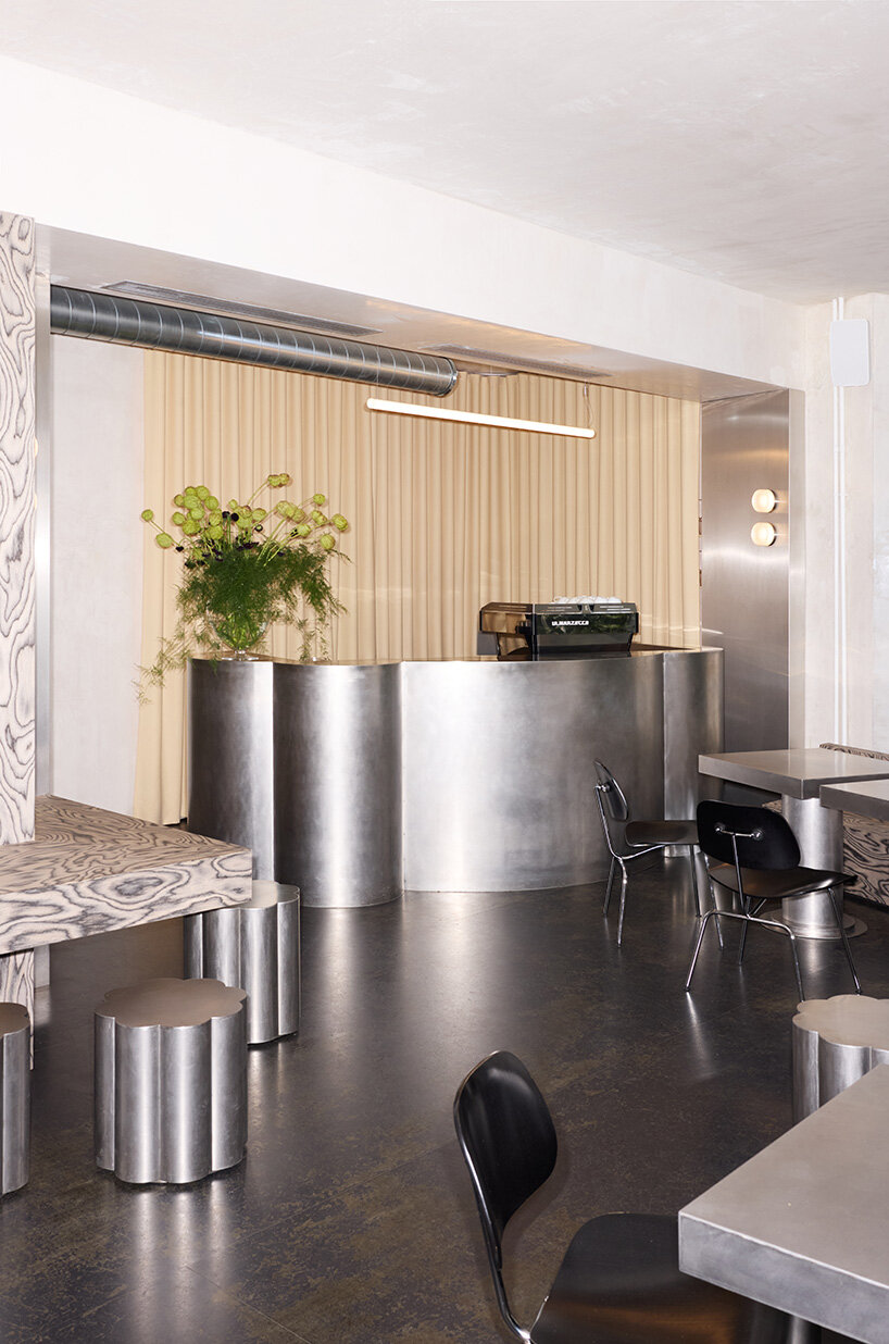 RDZ studio sculpts soft futurism into zurich café with floating cloud bar and tactile interiors post thumbnail image