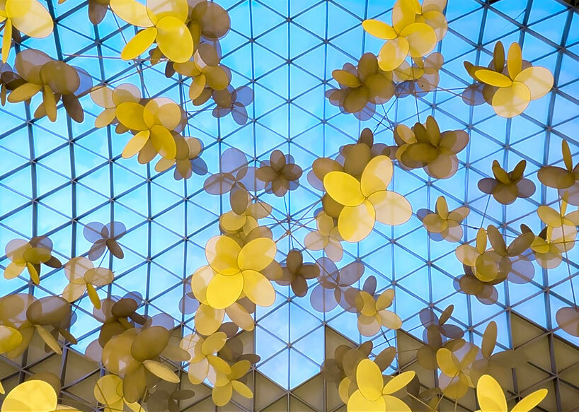 vincent leroy’s kinetic installation of metallic mesh flowers floats above hainan island in china post thumbnail image
