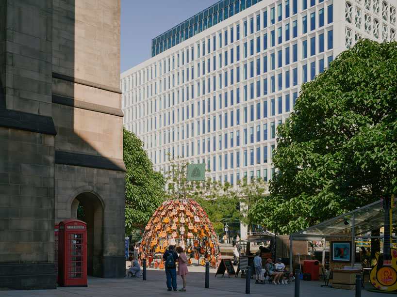 wind-powered sculpture turns donated guitars into sonic art installation in manchester post thumbnail image